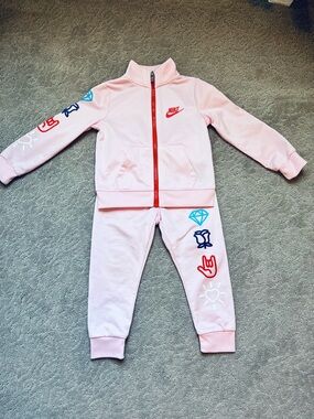 Nike Swoosh Pink Jacket with Red Zipper and Logo